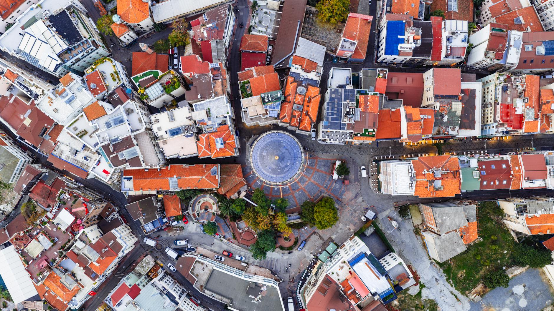 Captivating aerial view of a bustling Istanbul neighborhood, showcasing vibrant rooftops and city layout.